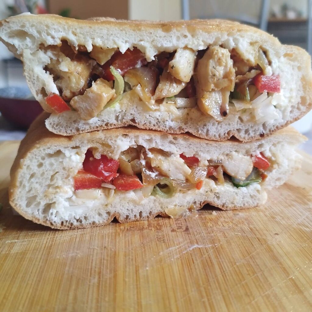 Breakfast chicken sandwich done and shown, cut in half