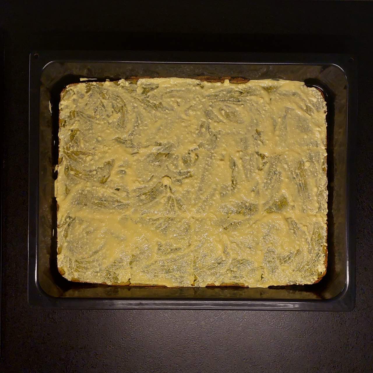 cornbread with spinach and cottage cheese mix glazed with topping