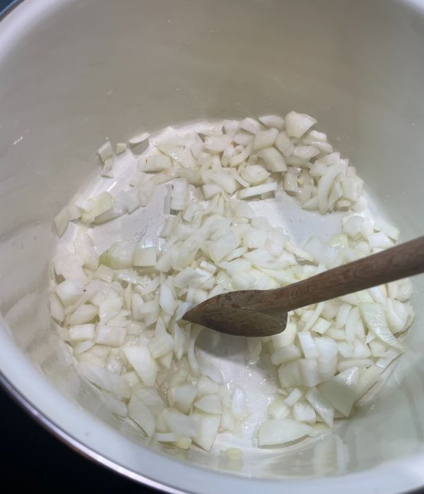 adding chopped garlic into a bowl