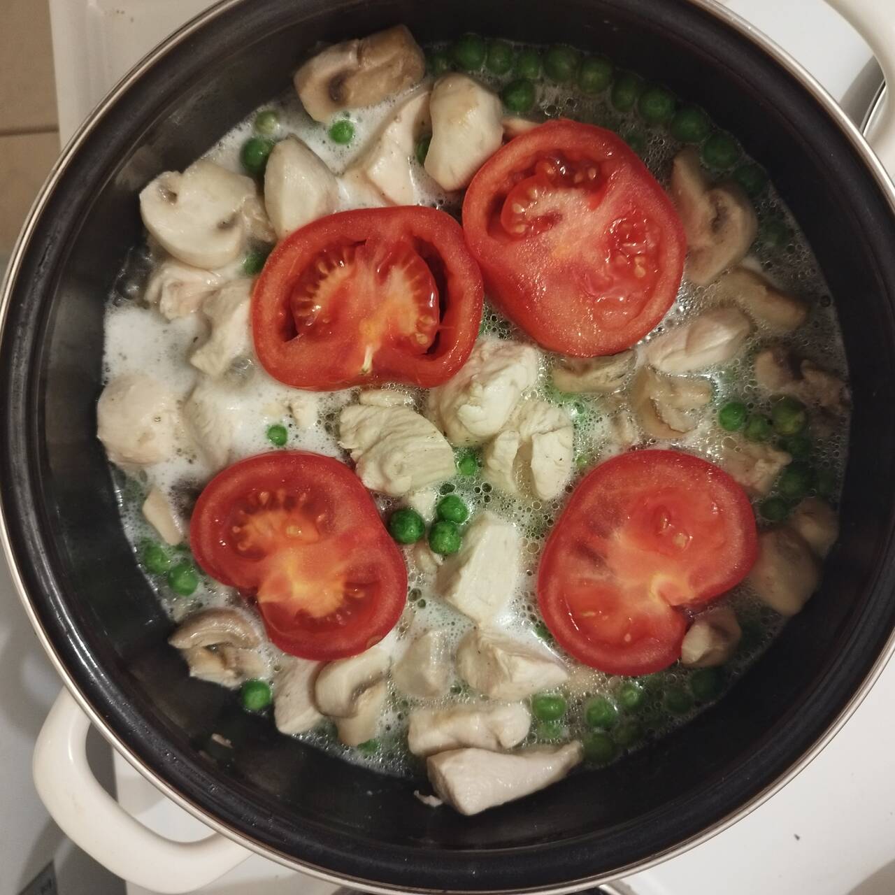 mushroom, tomatoes, chicken meat, green peas cooking in a pot, step 2