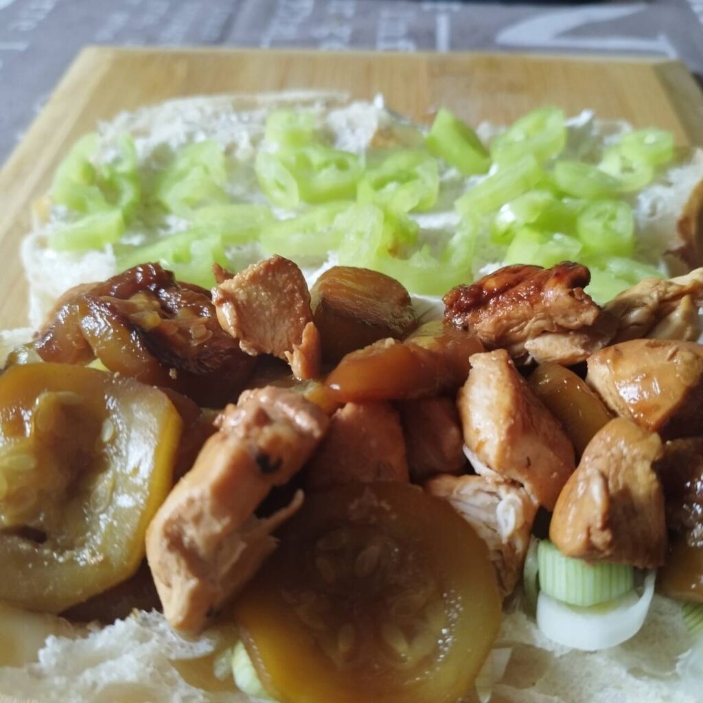 Soy chicken and zucchini sandwich with spring onions and bell peppers