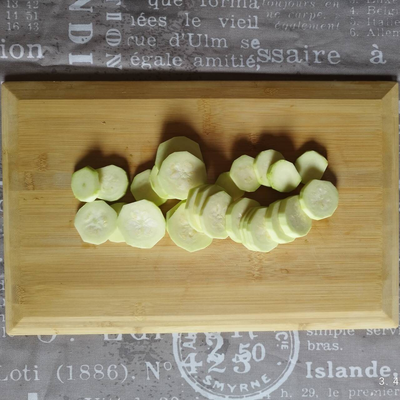 Zucchini cut into small, circle pieces on a cutting board